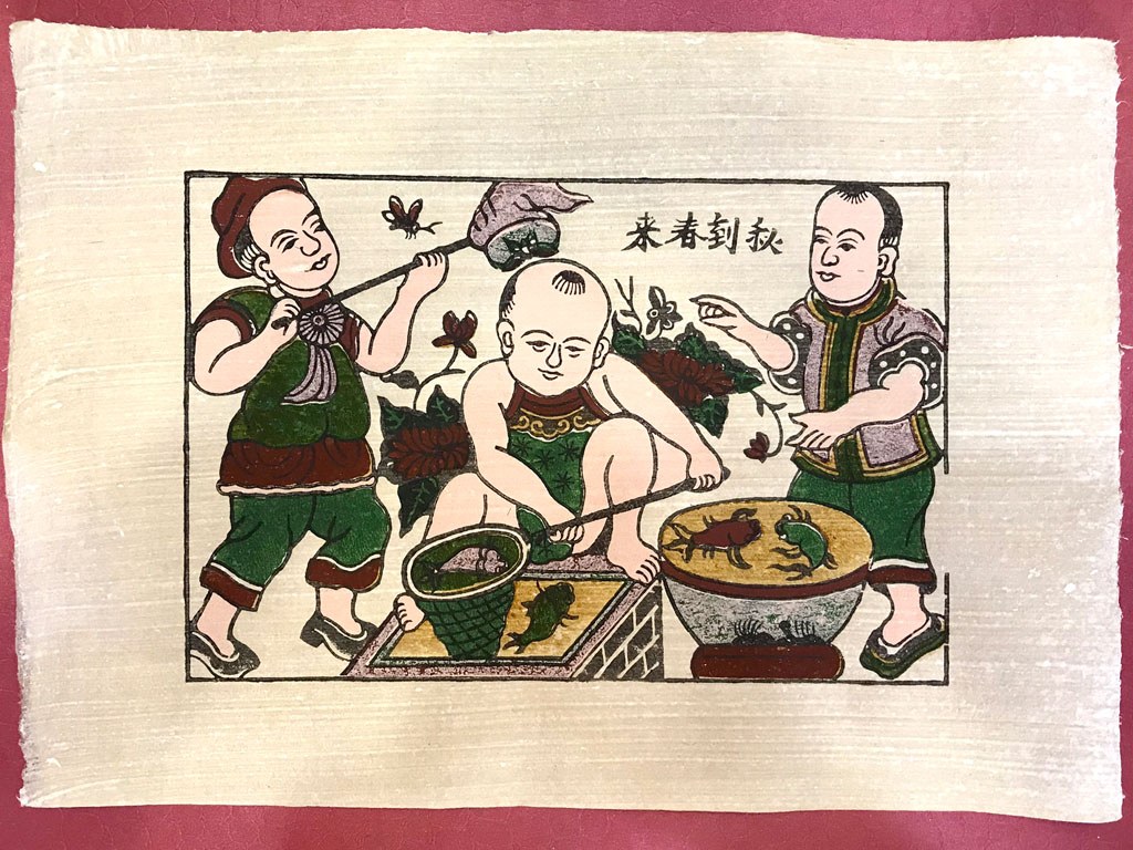 Đông Hồ print of three children catching fish in a basin