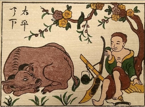 Đông Hồ print of a herd boy resting beside a buffalo under a tree